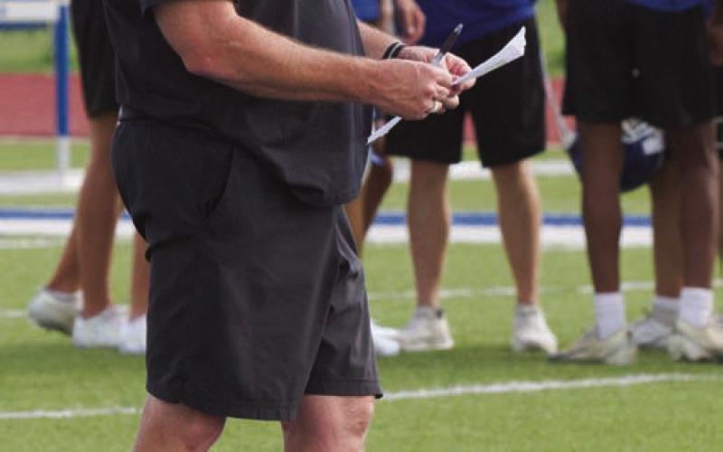 Lampasas’ Head Football Coach Troy Rogers looks over notes on Tuesday, the second day of practice. ERICK MITCHELL | DISPATCH RECORD