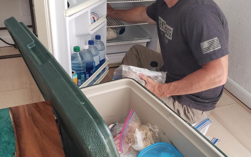 In a bed and breakfast in New Mexico, columnist Alexandria Randolph’s husband, Chris, packs fresh food from the hotel refrigerator into a cooler as they prepare for the next stage of their July road trip. Alexandria Randolph | Dispatch record