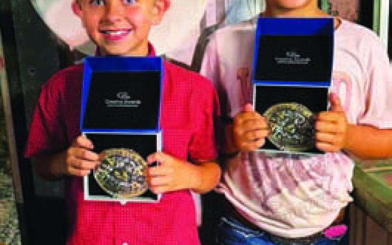 Kiptyn Russell (left) and Millie Cole Mueller were named the 2026 Lometa FFA Junior Rodeo 8-and-Under All-Around Cowboy and Cowgirl. COURTESY PHOTO