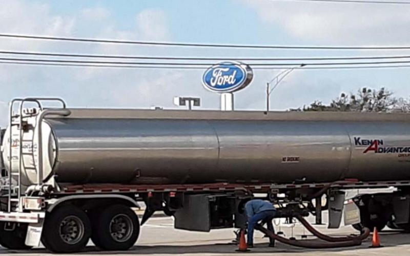 A tanker fills fuel pumps at the Stripes station on North Key Avenue. JEFF LOWE | DISPATCH RECORD