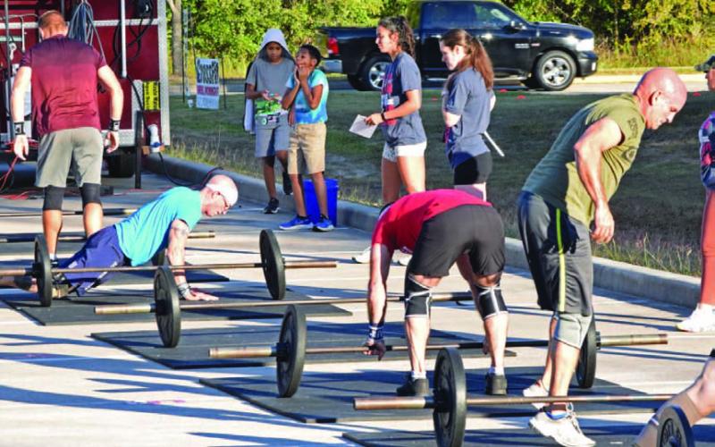 ALEXANDRIA RANDOLPH | DISPATCH RECORD Group workouts, even in organized settings like this east Houston competition, encourage rapport, healthy competitiveness and accountability.