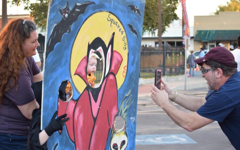 At a recent Squared Silly, participants could take photos using Halloween cutouts such as this. A variety of activities will be offered on the downtown square this year. FILE PHOTO