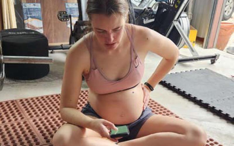 Columnist Alexandria Randolph rests post workout and logs her activity on a tracker app during her sixth month of pregnancy. Mothers who exercise during pregnancy have lower risk of pregnancy and labor complications. Alexandria Randolph | Lampasas Dispatch Record