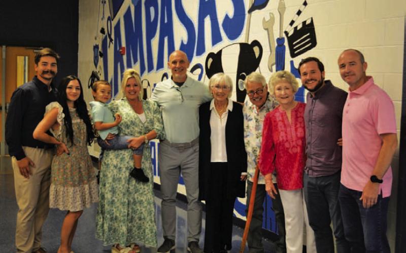 Assistant Superintendent Dana Holcomb, center, is surrounded by family members who were on hand at the Lampasas ISD end-of-year event to celebrate his service to the school district and his upcoming retirement. ERICK MITCHELL | DISPATCH RECORD