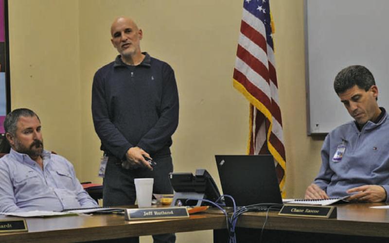 Assistant Superintendent Dana Holcomb, standing, provides Lampasas ISD Board of Trustees members with the annual Texas Academic Performance Review from the Texas Education Agency. Also pictured are trustee Jeff Rutland, at left, and Superintendent Dr. Chane Rascoe. ERICK MITCHELL | DISPATCH RECORD