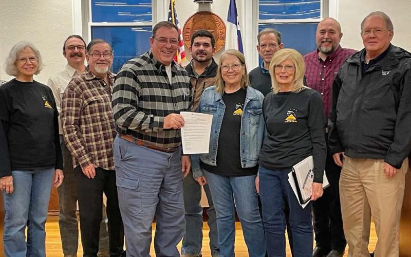 Members of Lampasas Friends of the Night Sky gather with the Lampasas City Council for a photo to celebrate the resolution proclaiming February as Night Sky Awareness Month. courtesy photo | friends of the niight sky
