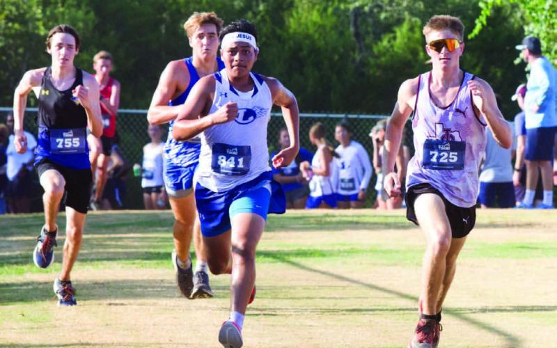Fidencio Gaspar goes full speed ahead to the finish line during the Badgers’ meet in Cedar Park on Friday. ERICK MITCHELL | DISPATCH RECORD