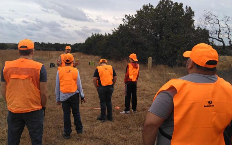 Bob Barnette, North Texas field operations coordinator for the Texas Youth Hunting Program, goes over rules with the young hunters on a recent trip in Lampasas County. COURTESY PHOTO