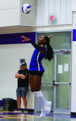 Angelina Davis leaps into the air and levels her serve over the net. Davis’ seven kills on the night were a team-high in the program sweep over Florence. ANA SOFIA MEYER | DISPATCH RECORD