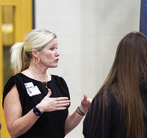 Annie Trotter, a representative of First Texas Bank of Lampasas, talks with Lampasas High School students about careers in finance and banking. HUNTER KING | DISPATCH RECORD
