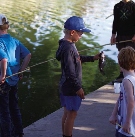 HUNTER KING | DISPATCH RECORD Bear Orlando shows off a catfish he caught on Wednesday.