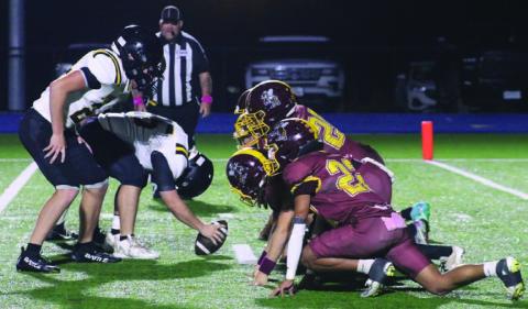 Hornet players locked in during an extra-point block during the loss to Jonesboro. MASON HINES | DISPATCH RECORD