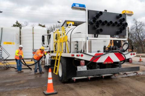 Highway crew members fill trucks with a brine solution to pretreat roadways. The brine slows the process of ice and snow bonding with the pavement. courtesy photo | texas department of transportation