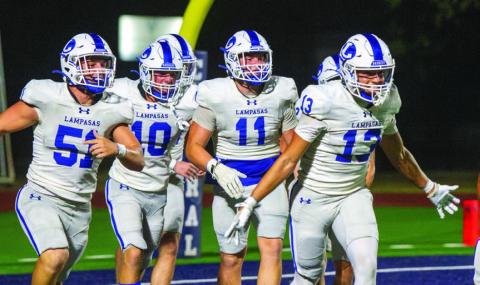 The Badgers’ defense, including Rylan Chapa (13), Campbell Roberts (51), Brayden Roberts (11) and Colton Harper (10) celebrate scoring a safety against Central Catholic before halfimte, the two points that allowed the Badgers to prevail before the game was canceled due to weather. ANA SOFIA MEYER | DISPATCH RECORD