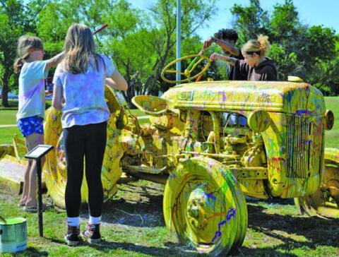 FILE PHOTO At the 2023 Arts in the Park for Kids festival, visitors were encouraged to help repaint a tractor in Campbell Park.