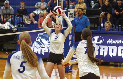 ANA SOFIA MEYER | DISPATCH RECORD Setter Ellie Felkner sets up middle Ysa Swain for the slam in the Lady Badgers’ win over Brentwood Christian on Tuesday. Lampasas looks forward to starting district play against Marble Falls on Sept. 22.
