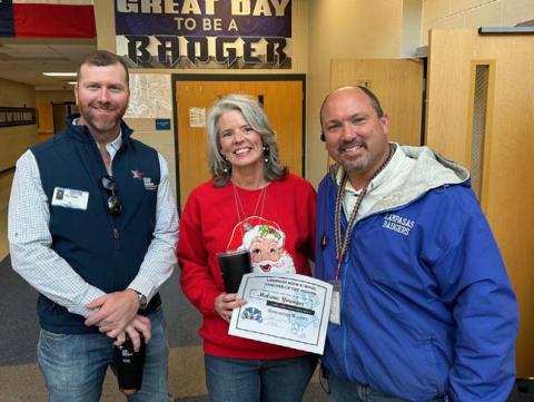 For November, Melanie Younger was named Teacher of the Month at Lampasas High School, where she is a math instructor and special education teacher. On hand to congratulate Younger are Clay Phillips, at left, of Texas Farm Bureau Insurance, and Assistant Principal Ryan Race, who said Younger “does a fabulous job building relationships and promoting learning with some of our students that struggle.” COURTESY PHOTO