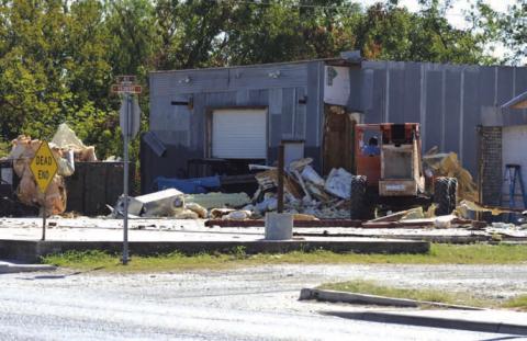 ERICK MITCHELL | DISPATCH RECORD Mike Irvin has begun demolition on property at the intersection of East Fourth Street and Hackberry Street near the Lampasas downtown square. Irvin plans to develop the site for an upscale restaurant that overlooks Sulphur Creek.