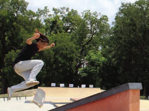 Zhen Brewer flips his board over the stairs, impressing the Born to Soar Skate Competition crowd. CHLOE COWDREY | DISPATCH RECORD