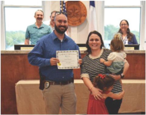 Officer Garrett Bradley was recognized at the Lampasas City Council meeting this week for his 10 years of service to the Lampasas Police Department. Pictured with Bradley are his wife and children. ANA SOFIA MEYER | DISPATCH RECORD