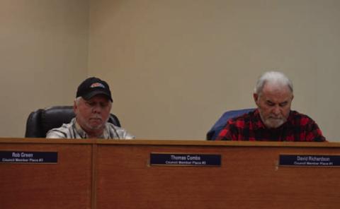 Place 2 Councilman Thomas Combs, at left, and Place 1 Councilman Dave Richardson glance at their notes during last week’s Kempner City Council meeting. ERICK MITCHELL | DISPATCH RECORD