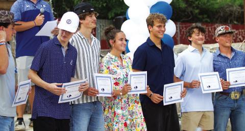 Badger baseball players and trainers show off their certificates on Monday evening. HUNTER KING | DISPATCH RECORD