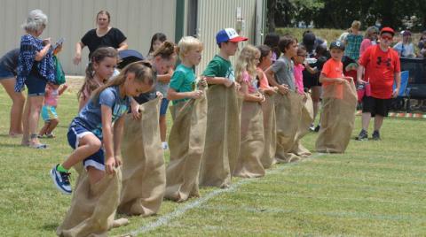 hunter king | LAMPASAS DISPATCH RECORD Children climb into their potato sacks before the command to begin during Spring Ho Kids’ Day activities on Friday.