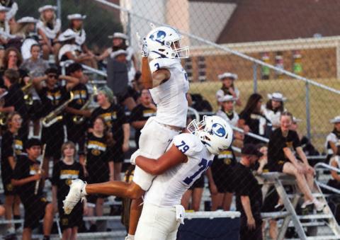 Senior wide receiver Tripp Stinnett celebrates his first touchdown of the season against Gatesville with offensive lineman Pablo Cortez. Stinnett finished the night with two receiving touchdowns. ANA SOFIA MEYERL | DISPATCH RECORD