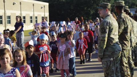 Students at Taylor Creek Elementary show their love for country and patriotic colors at a commemorative parade and assembly last Thursday morning. For more on the event that recognized the 24th anniversary of the 9/11 attacks on the nation, see page 2. ERICK MITCHELL | DISPATCH RECORD