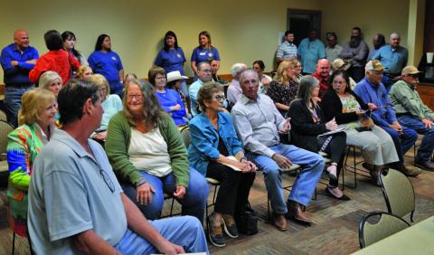 Several dozen residents attended Monday’s Lampasas County Commissioners Court meeting to protest a private railway reconstruction project that would slice through Burnet and Lampasas counties. ERICK MITCHELL | DISPATCH RECORD
