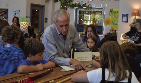 Texas Historical Commission archaeologist Chris Meis explains the hunting technology used by Native Americans to Hanna Springs Elementary School fourth-grade students during Wednesday’s lesson. ERICK MITCHELL | DISPATCH RECORD