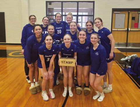 COURTESY PHOTO The Lady Badgers pose with the STAMP award at the Brady tournament.