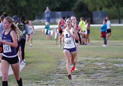 Leah Phillips shows emotion as she approaches the finish line at the district meet. HUNTER KING | DISPATCH RECORD