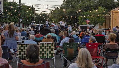 Western Night on Western attendees enjoy relaxing in their chairs while listening to the tunes of the Jason Roberts Band. ADAM BARRIOS| DISPATCH RECORD