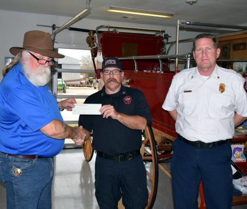 Accepting a $500 donation from Sartoga Masonic Lodge #546 representative Senior Warden Guy R. Niles for the Lampasas Fire Department’s annual toy drive are Deputy Chief of Operations Cory Greiner, center, and Deputy Chief of Administration Joe Adams. dorton q. matthews | courtesy photo