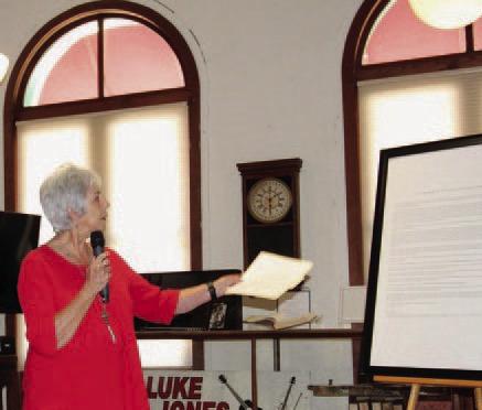 Mayor TJ Monroe, standing at the Lampasas County Museum, reads the proclamation opening a year of celebration for the Lampasas sesquicentennial. JOYCESARAH MCCABE | DISPATCH RECORD
