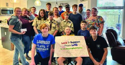 Front and center, Luke Sappenfield is surrounded by family members and Scouts from Troop 200, Troop 400 and Pack 100 who have helped raise funds for the Sappenfields’ medical expenses. COURTESY PHOTO