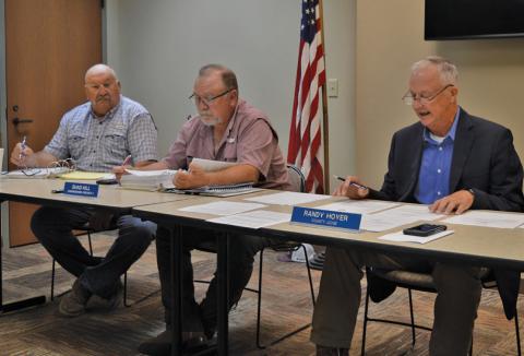 Lampasas County Commissioners Court convened in the conference room at the county annex on Monday, as rehabilitation work continues in the courthouse. Pictured are, from left, Commissioner Mark Rainwater, Commissioner Shad Hill and County Judge Randy Hoyer. erick Mitchell | dispatch record