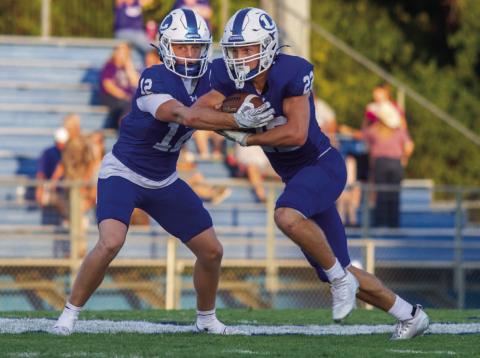 Sophomore quarterback Ross Kothmann makes the handoff to running back John Stenson in the Badgers’ Week 2 non-district game versus Pflugerville Connally. The Badgers went into overtime for the first time since 2018 and ultimately lost on the Cougars’ successful extra point. ANA SOFIA MEYER| DISPATCH RECORD