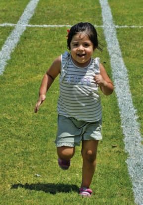 ERICK MITCHELL | DISPATCH RECORD Amayka Guerra eyes the finish line during her relay race.