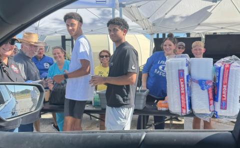 Volunteers were on hand Aug. 13 outside Grace Fellowship for a drive-through pork chop dinner fundraiser to benefit Building Badgers Youth League. Benny Boyd provided all the food so proceeds could be used for the BBYL young Badgers athletic programs. COURTESY PHOTO