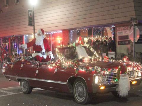 Santa is expected to ride in style for this year’s Holidazzle Lighted Christmas Parade, as he did in previous parades through downtown Lampasas. The jolly old man will be available Saturday from 3-4 p.m. at the Ajinomoto Foods lobby, 601 E. Third St., for photos before he joins the parade later in the evening. FILE PHOTO