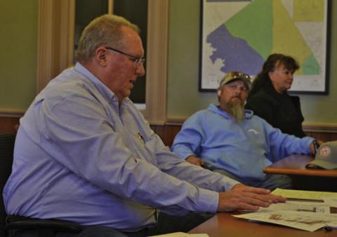 Dan Johnson, at left, attended the Commissioners Court workshop to answer questions about the RKJ Construction bid for courthouse renovation work. He serves as vice president of the local firm. ERICK MITCHELL | DISPATCH RECORD