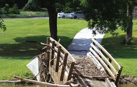 The cart path at Hole No. 6 on the Hancock Park Golf Course was destroyed by floodwaters last July. The Lampasas City Council will seek an engineering study before repairs are undertaken on the structure. FILE PHOTO