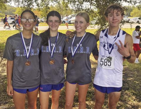 KIMBERLY BURNSIDE | COURTESY PHOTO From left, Addi Ortegon, Alix McMasters, Hadlee McCorkle and Cohen Watson wear the medals they brought home from Friday’s Temple Invitational.