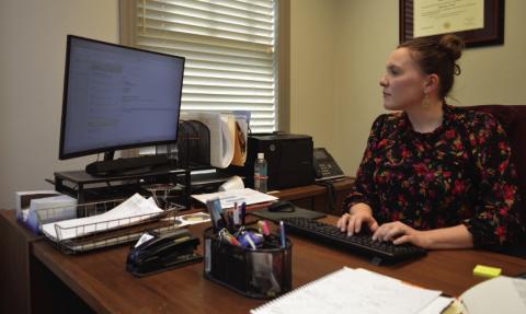 County Attorney Jessica Guy works from her desk at the Lampasas County Office Building. ERICK MITCHELL | DISPATCH RECORD