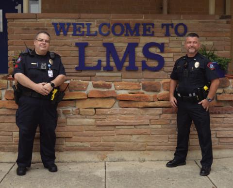 Sgt. Steve Sheldon, at left, and Patrol Lt. Chuck Montgomery of the Lampasas Police Department stand outside Lampasas Middle School. Sheldon is a school resource officer at the campus and supervises the other SROs in the school district, while Montgomery oversees the program. Lampasas ISD and the city of Lampasas have an agreement to provide at least one police officer per campus to enhance safety measures in place. ERICK MITCHELL | DISPATCH RECORD