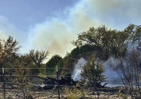 FILE PHOTO Smoke from a past wildfire is shown. Lampasas County remains under a burn ban.