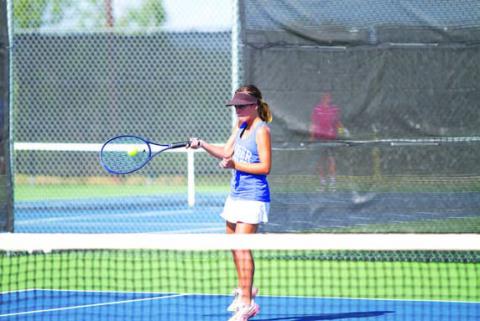Sam Lopez hits a forehand shot during a match earlier this season. HUNTER KING | DISPATCH RECORD