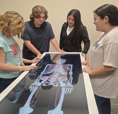 CHERI JAY-WIENECKE | DISPATCH RECORD Lometa medical teacher Valarie Nixon works with students on the Anatomage Table the district purchased with funds from a Texas Workforce Jobs and Education for Texans Grant. Pictured are, from left to right, Nixon, Tepekos Bowers, Amy Padron and Sophie Anguiano.